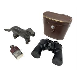 Cast metal nutcracker, in the form of a dog together with a pair of Swift Saratoga 8x40 binoculars in leather case and a hip flask, the glass flask covered in leather to the top with a detachable silver plated cup to base