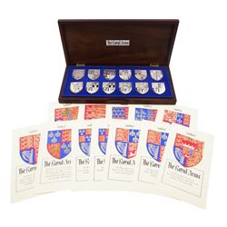 Yorkshire Mint, The Royal Arms Collection, twelve shield shaped silver medallions each depicting variations on the Royal coat of arms, each hallmarked Yorkshire Mint, Birmingham 1976/77, contained within fitted wooden case with associated information cards