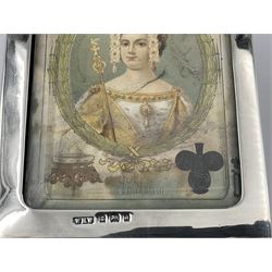 Edwardian silver mounted playing card case, hallmarked William Harrison Walter, Birmingham 1903, the sides each with a period playing card set behind a bevelled glass panel, the hinged cover with later engraving 'Presented to Norman T Crombie Esq by the officers & men of the 31st WR Detachment for services rendered 1917-1918', with red leather lined interior, the three compartments upon a sprung base and containing two later wooden Whist markers, case H12.5cm