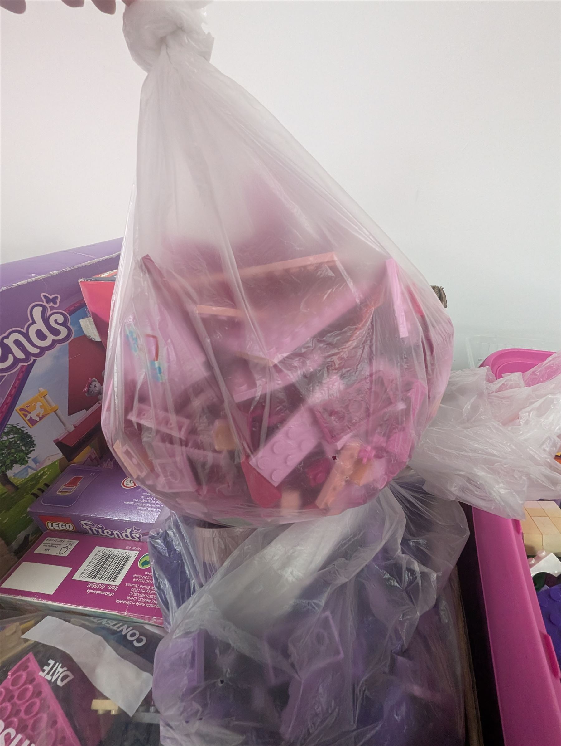 Lego Friends no. 3189 Stables set, Lego Trolls no. 41252 World Tour set, The Lego Movie set no. 70825, three small Lego Friends sets, all boxed and a quantity of loose Lego, including purple and pink colourways