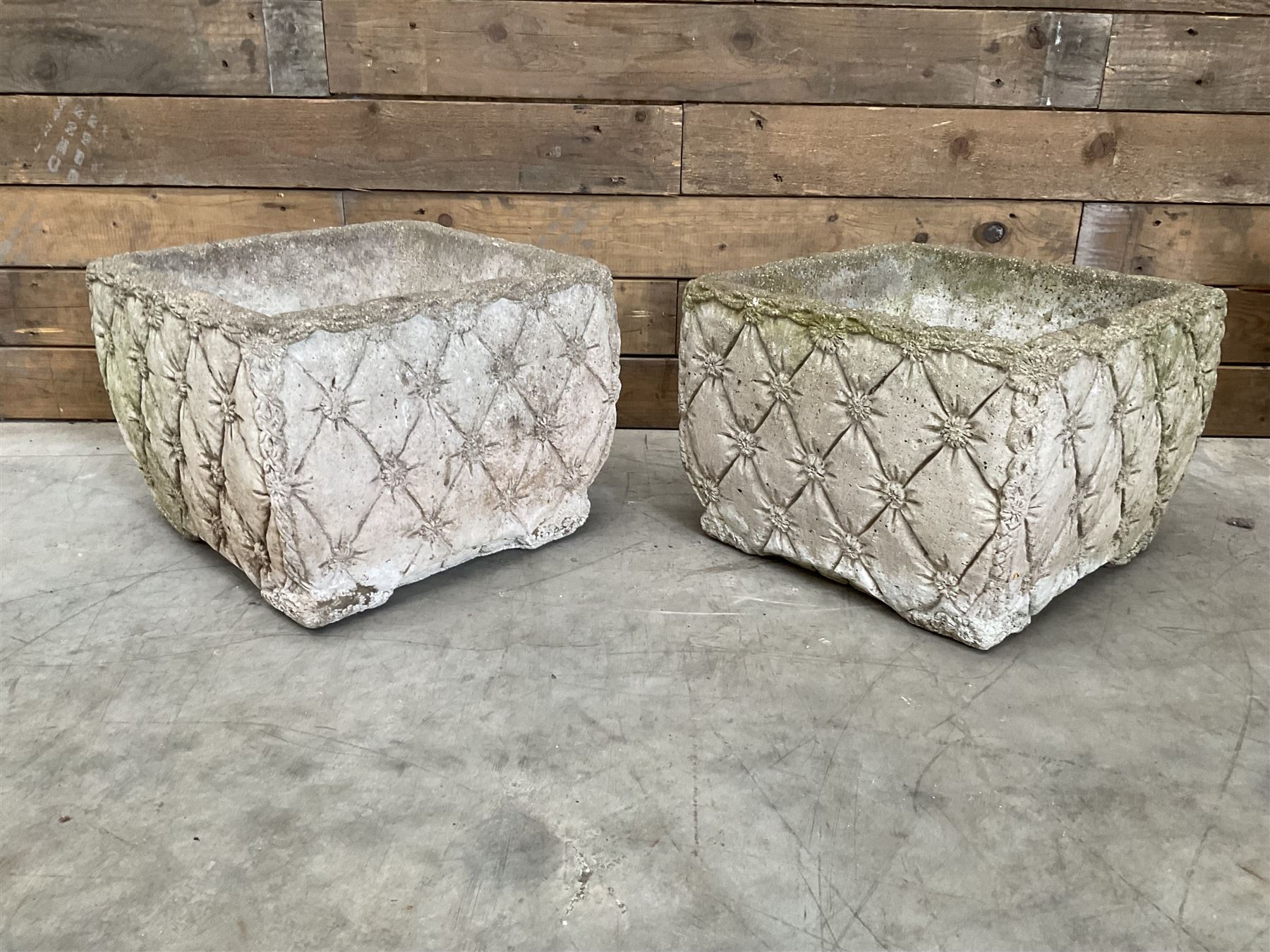 Pair of weathered cast stone square planters, daisy chain detail, one stamped