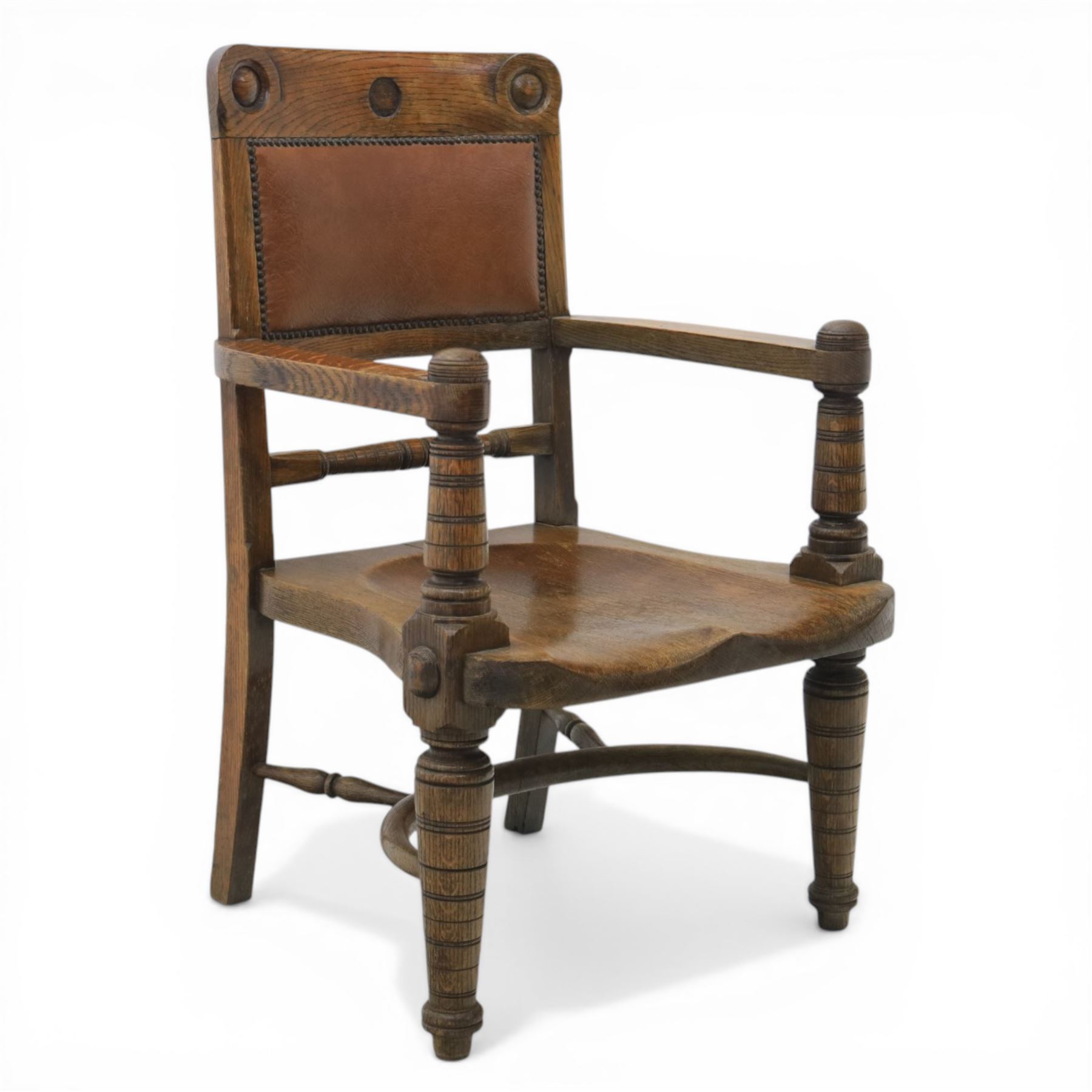 Arts and Crafts oak open armchair with dished seat