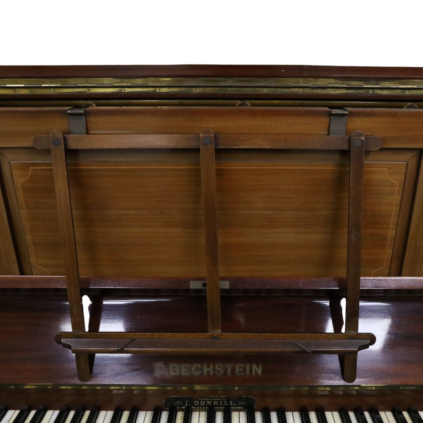 Edwardian C. Bechstein mahogany cased upright piano, with ivory keys and two pedals, manufactured expressly for J Dunnill Wakefield, serial no. , H123cm, W150cm
