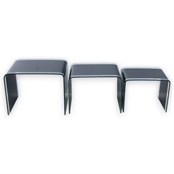 Nest of three contemporary glass occasional tables, black glass centres with  clear glass borders 