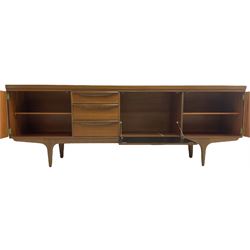 Greaves & Thomas - mid-20th century teak sideboard, fitted with three drawers, fall front compartment, and two end cupboards, on tapering supports