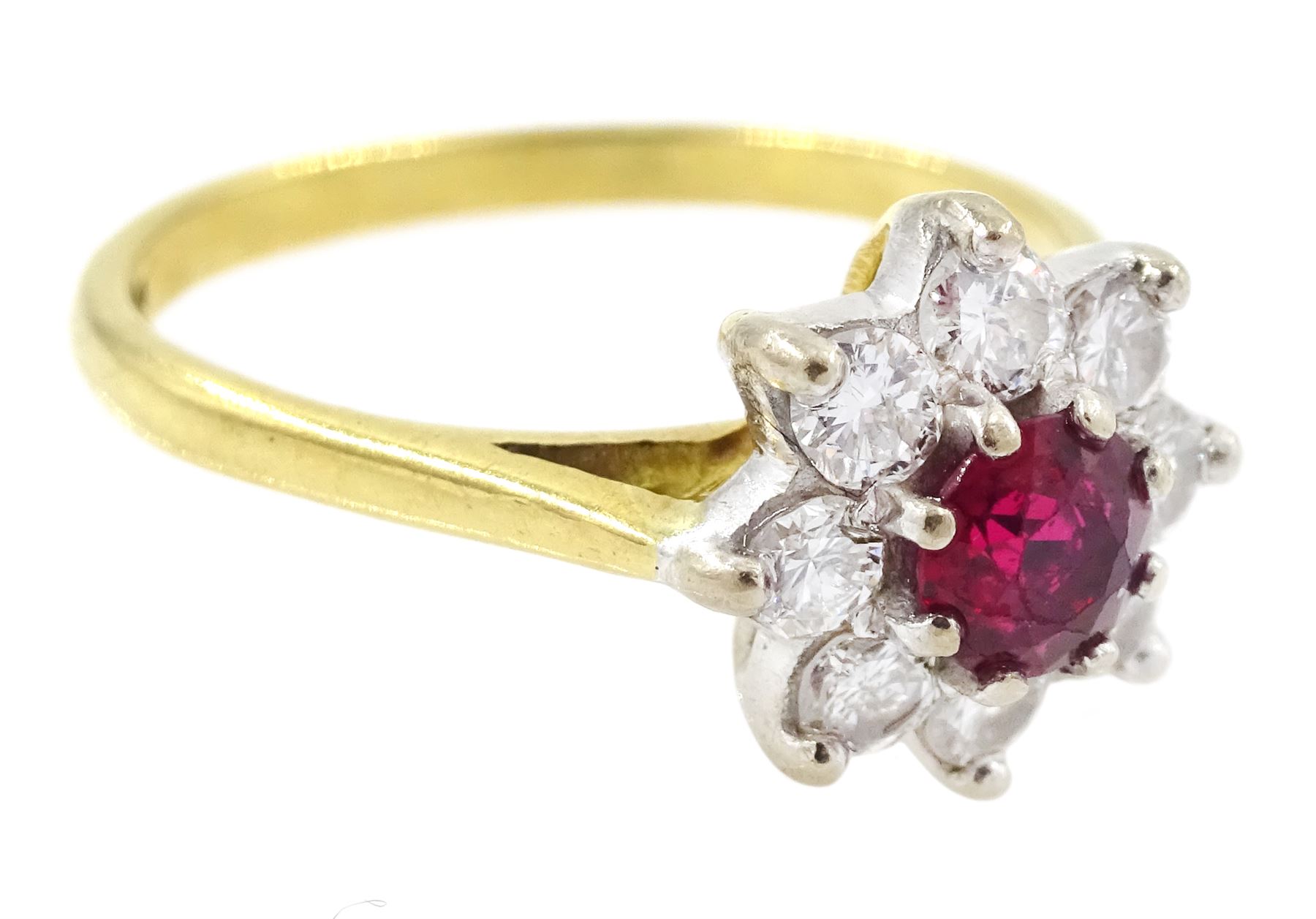 Gold ruby and diamond cluster ring, round cut ruby of approx 0.25 carat, surrounded by eight round brilliant cut diamonds, stamped 18ct, total diamond weight approx 0.40 carat