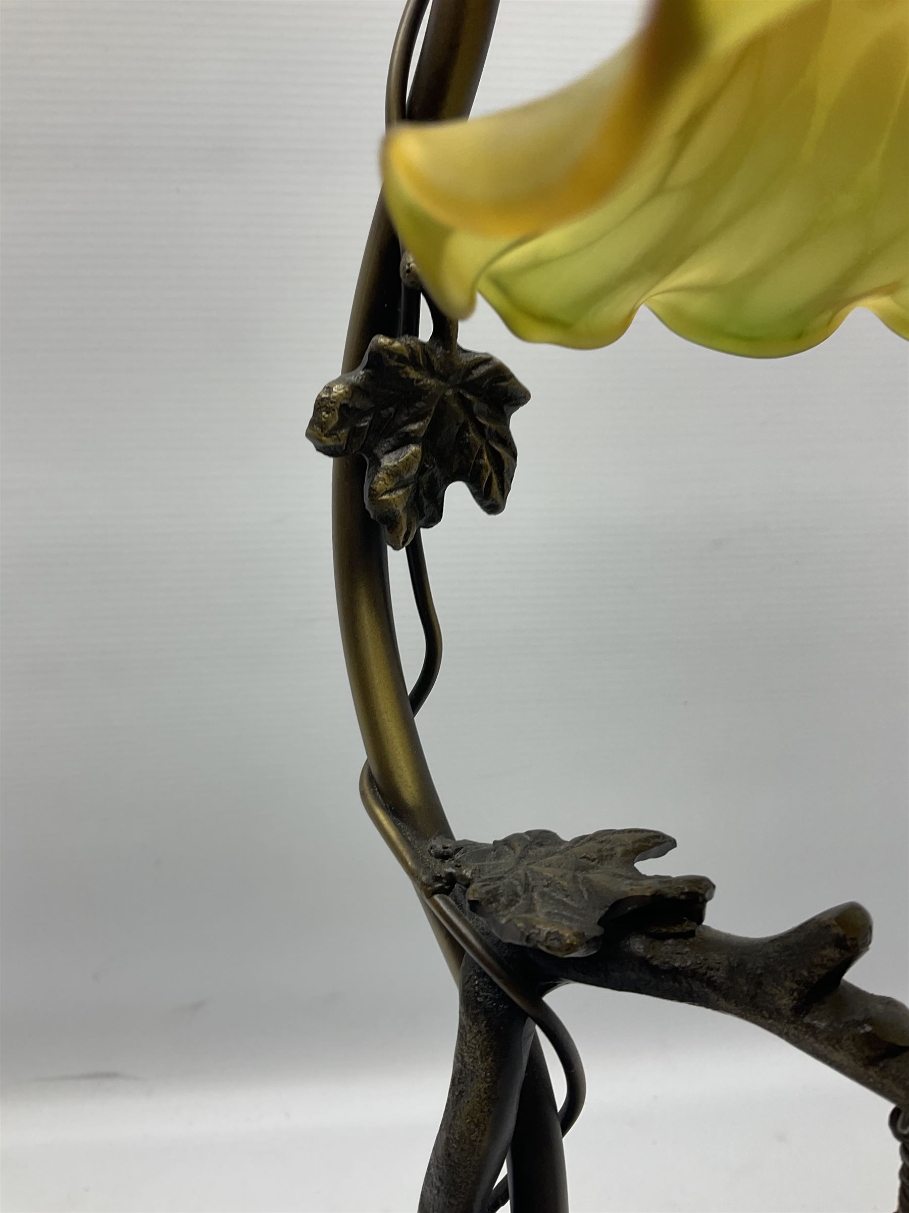 Art Nouveau style lamp in the form of a woman on a swing, with a green mottled shade, upon a marble base H52cm
