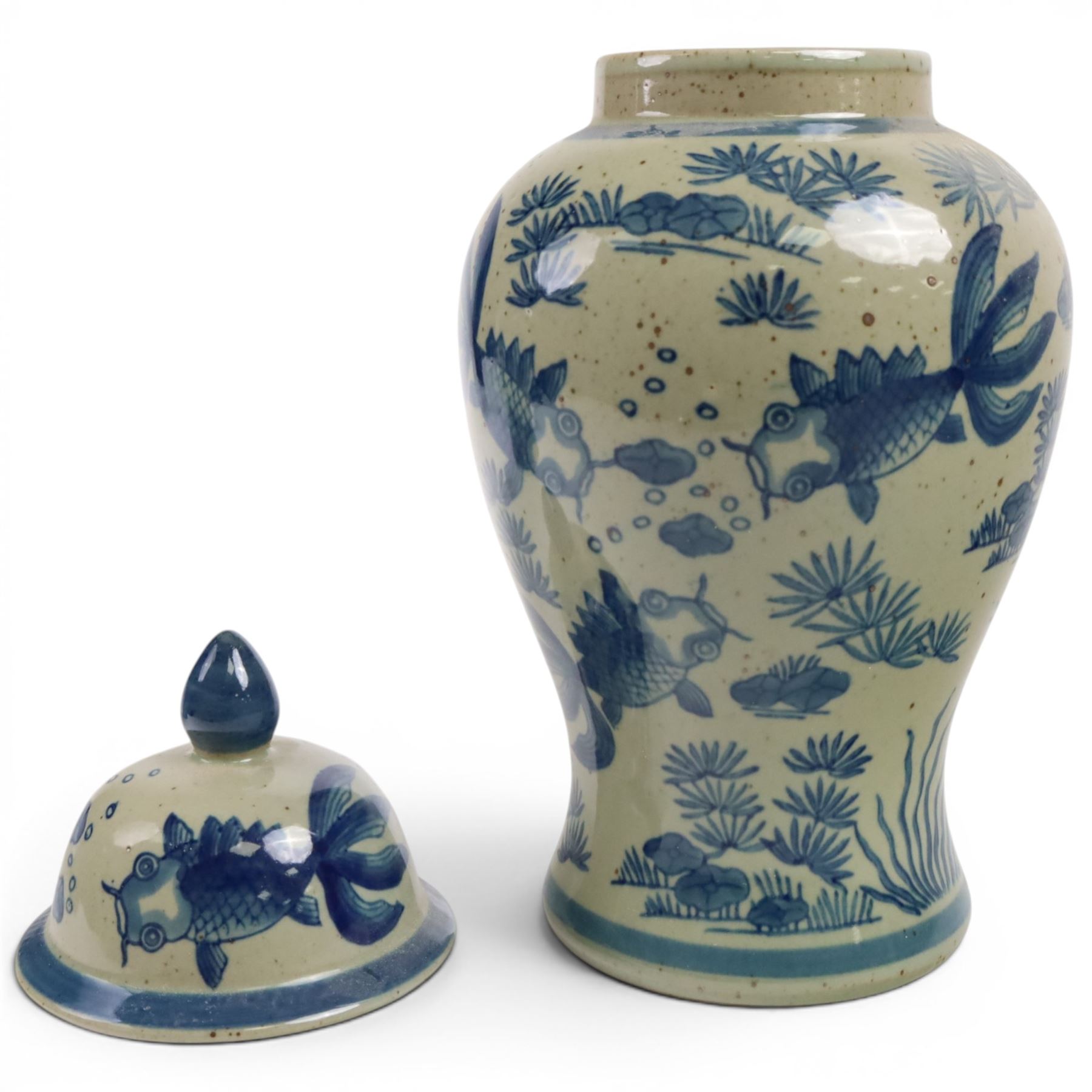 Pair of Chinese blue and white jars and covers, of baluster form, painted with fish and foliage H36cm
