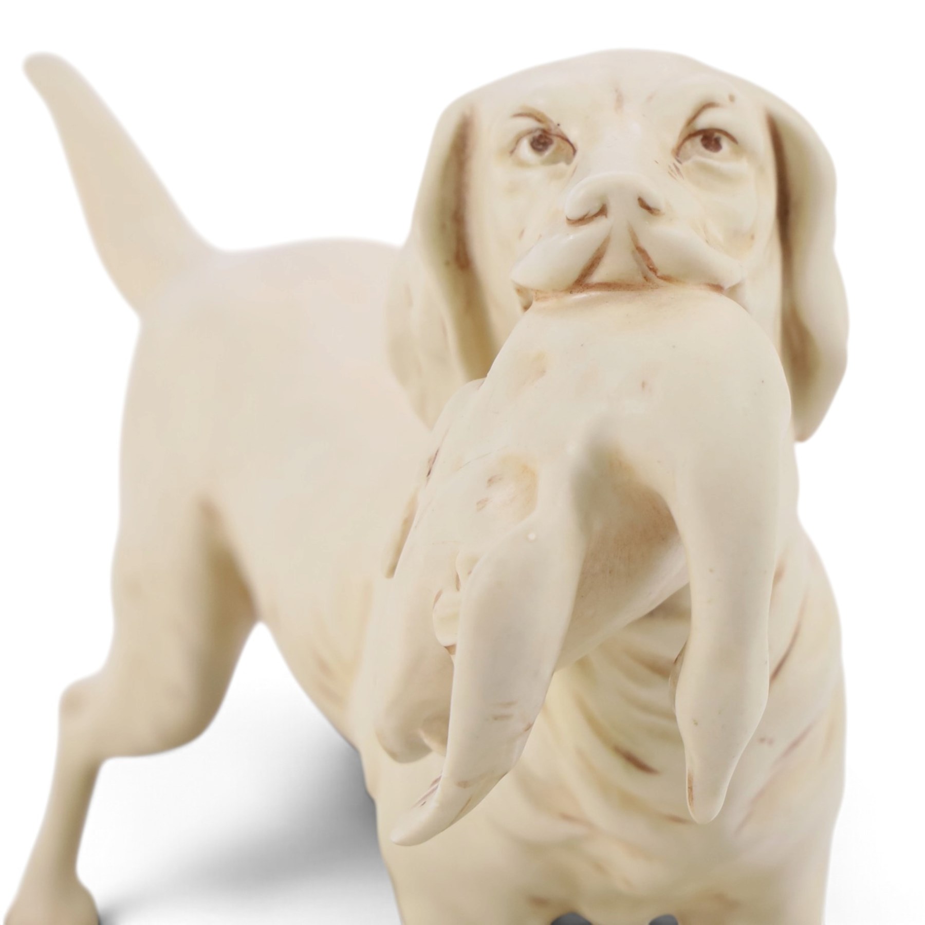 Royal Dux model of a hunting dog, with bird in mouth, upon gilt and green rustic base, marks beneath impressed  1193 and bearing pink applied Royal Dux triangle 