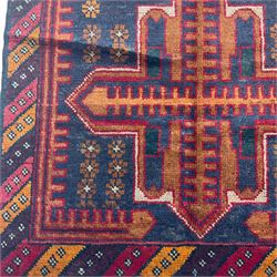 Persian Baluchi rug, two cross medallions and decorated with stylised flower heads