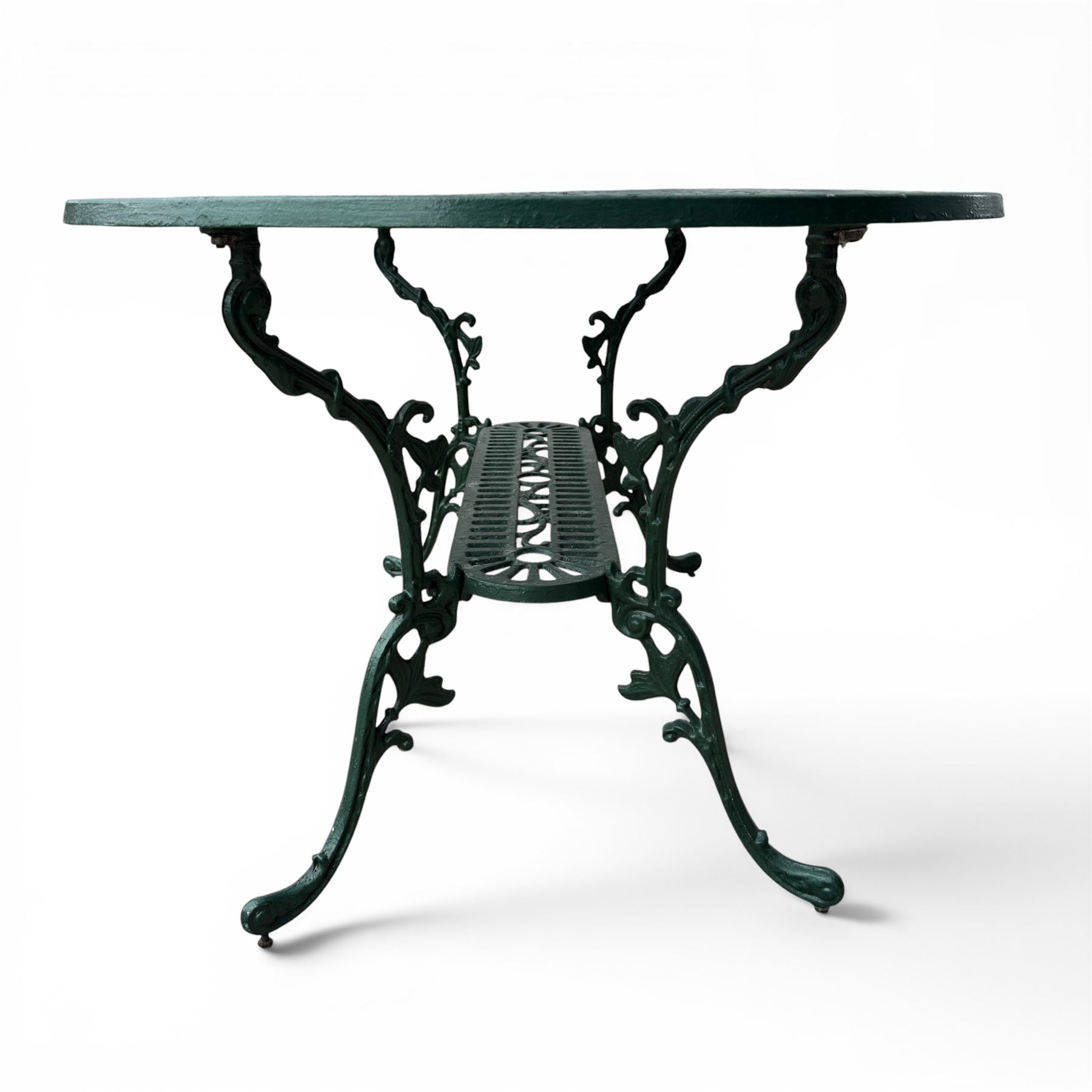 Cast aluminium oval garden table and set of four armchairs with pierced rose design back splats