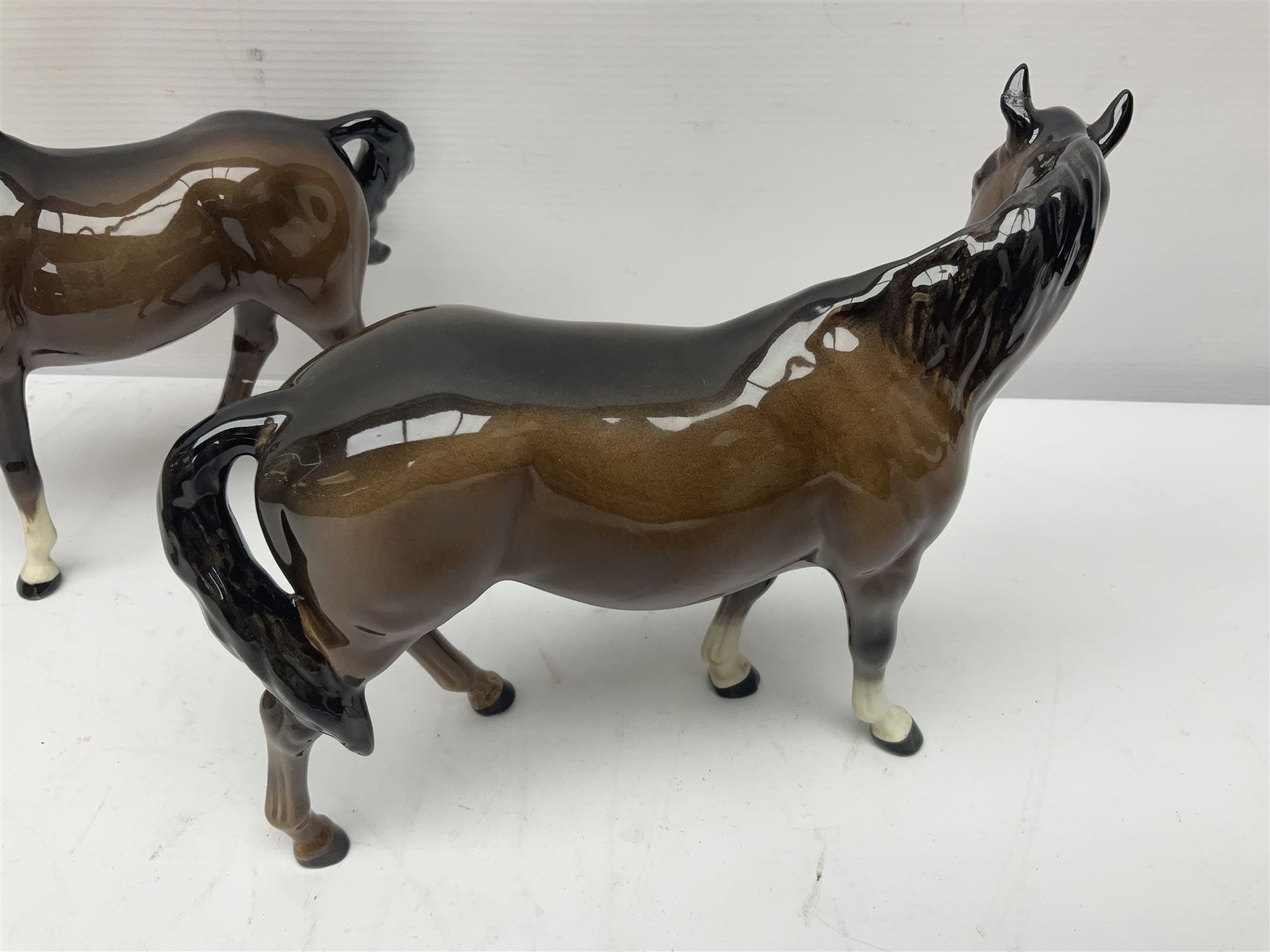 Four Beswick horses, including Exmoor no 1645, Black Beauty foal and two others 