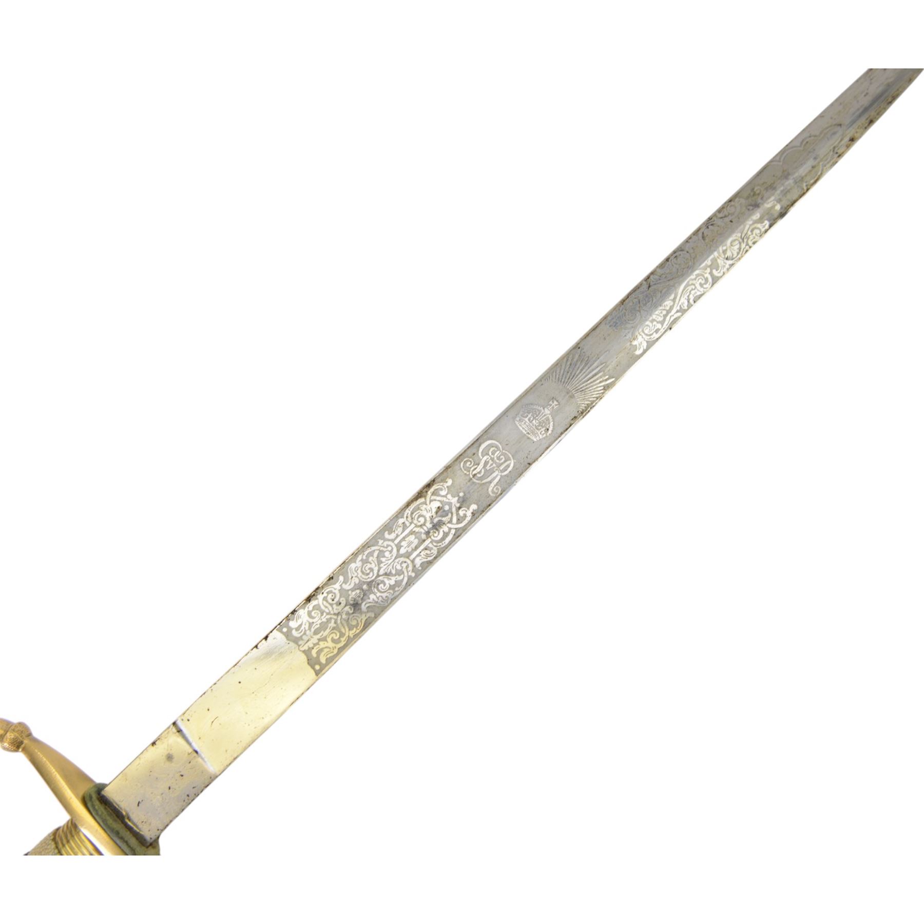 George V midshipman`s dirk, the 45cm straight single edged blade, length etched with crowned GRV cypher and anchor foliate scrolls, gilded brass hilt with lion`s head pommel and wirebound fishskin covered grip, in brass mounted leather sheath, the upper mount engraved  'C.R.B', with a cord and wire knife knot, overall L6cm` 