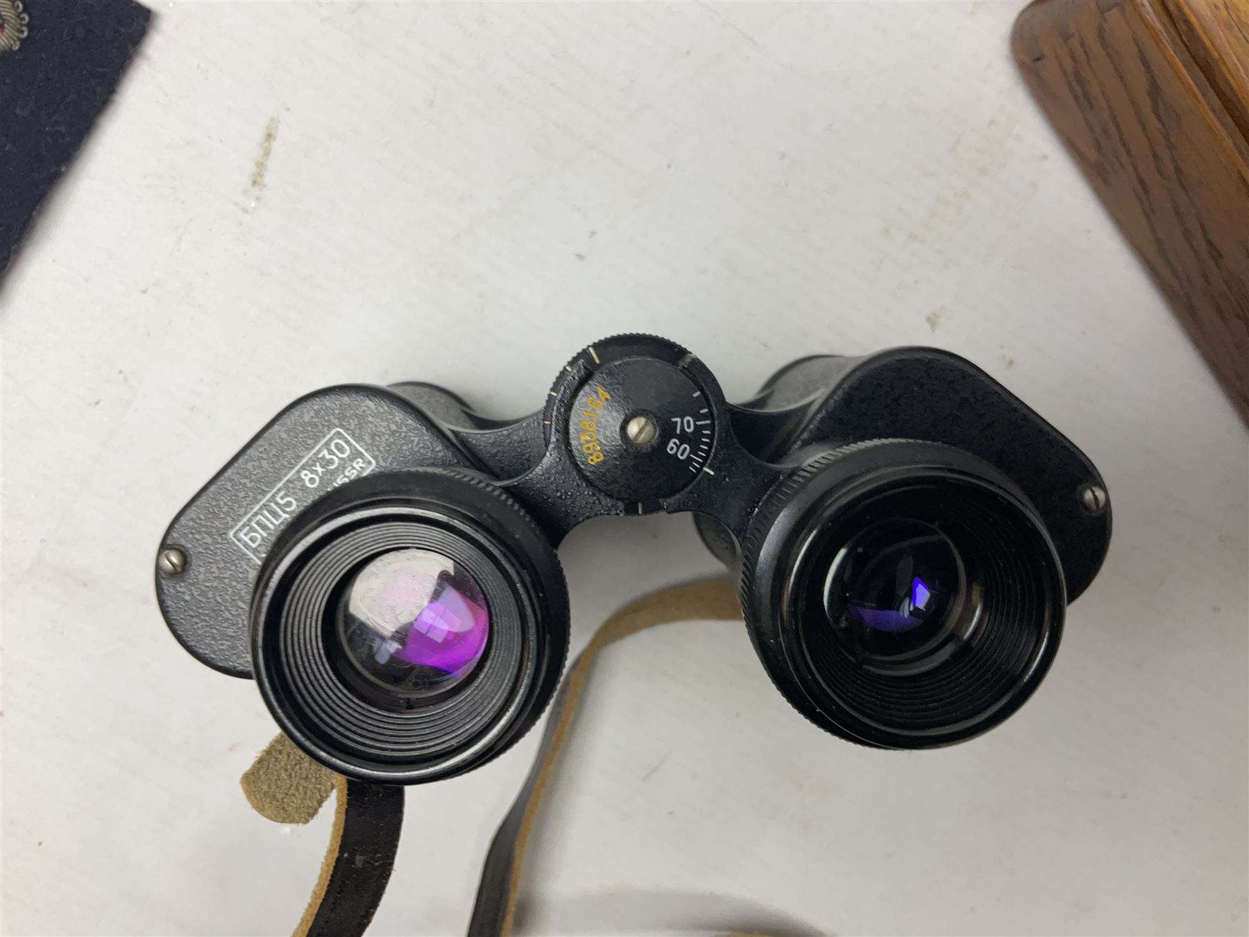 Three pairs of binoculars to include Enbeeco Concord and Bresser, Palestine police patch, framed pictures etc