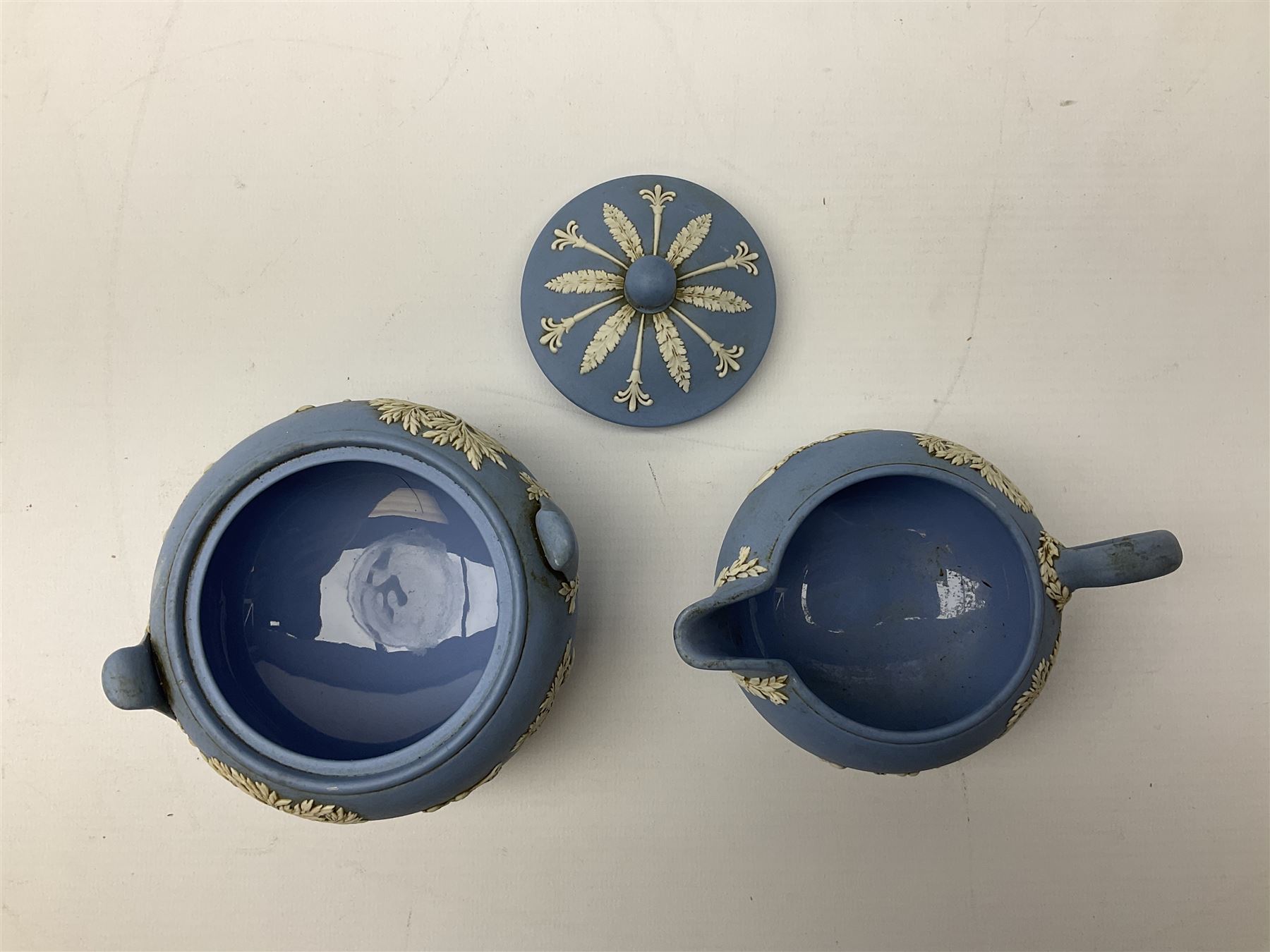 Late 19th century pale blue Wedgwood Jasperware cheese dome with cover, decorated with acorn and oak leaf bands surrounding neo-classical ladies, cherubs, flowers and trees, impressed Wedgwood mark beneath, together with further Wedgwood Jasperware teapots, boxed dishes etc