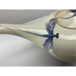 Franz Teapot decorated with dragonflies, together with a matching sucrier and cover and a cup and saucer in Iris pattern, all with printed mark beneath 