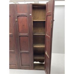 Early 20th century stained pine school locker cupboard, three cupboard doors enclosing shelving 