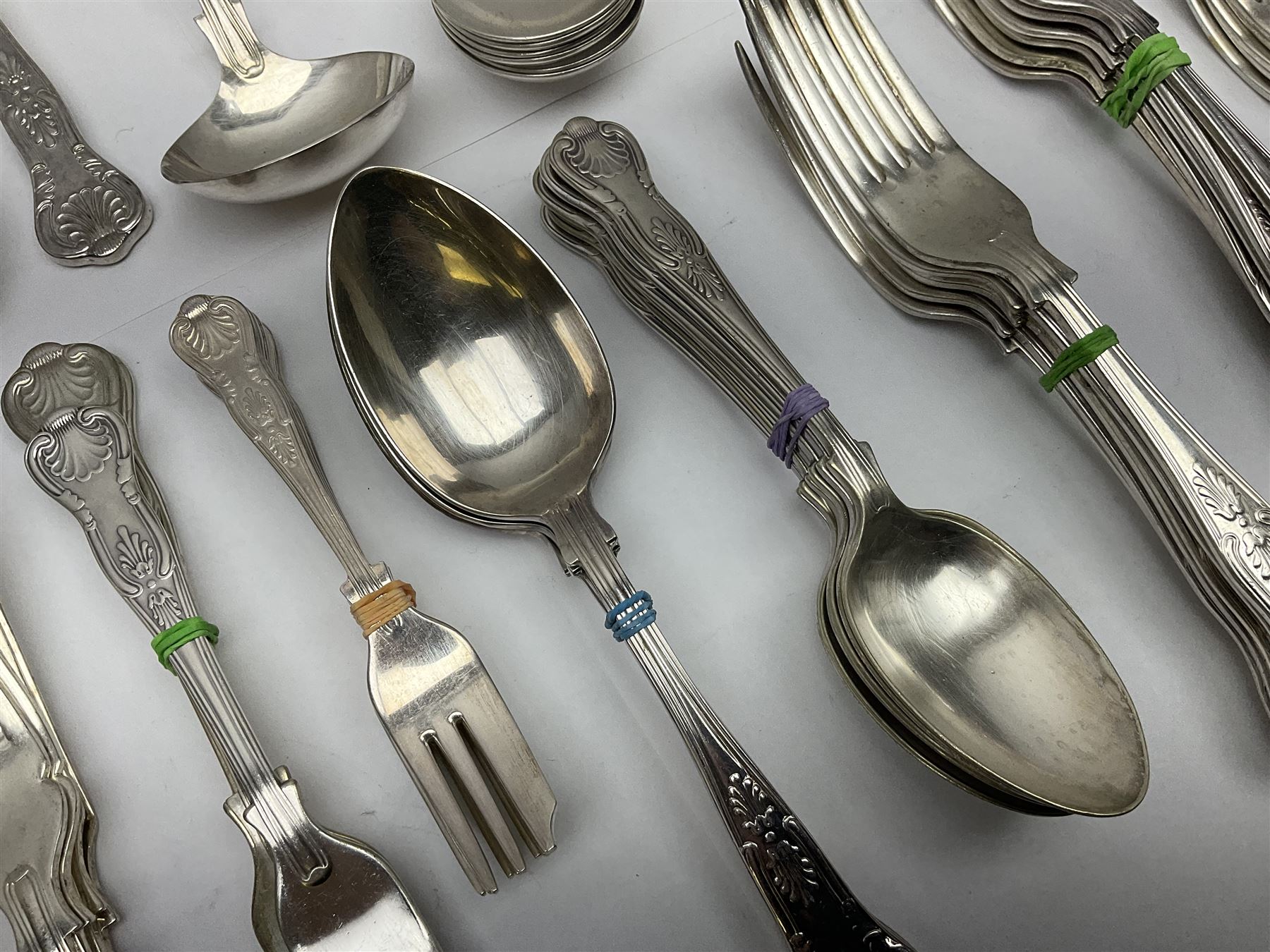 Silver Kings pattern knife, hallmarked Walker & Hall, together with a quantity of silver plated Kings pattern cutlery, including items by Osbourne's and United Cutlers, comprising table knives, table forks, table spoons, serving forks, ladle, berry spoons, teaspoons, dessert forks, cake slice, etc
