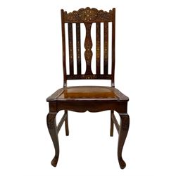 Pakistan carved hardwood brass inlaid circular dining table, and four rail back chairs with saddle seats