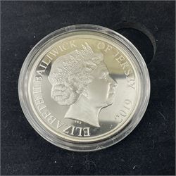 King Charles III 2023 'Coronation Silver Proof Mint Masters Set' comprising Bailiwick of Jersey, Bailiwick of Guernsey and Isle of Man sterling silver proof five pound coins, cased with certificate and Queen Elizabeth II 2019 Bailiwick of Jersey 'Remember With Us' silver two pound and five pound pair, cased with CPM certificate