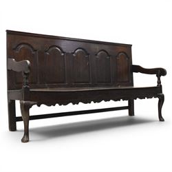 George III oak settle bench, with five gothic arched field panels, with downswept arms rai...