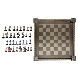 Modern figural chess set, with painted lead figures, together with a chess board modelled as a castle fortress