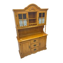 Hardwood dresser, the raised back enclosed by glazed doors, the lower section fitted with two cupboards and three drawers