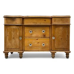 Late 19th century pine dresser base, serpentine rectangular top over three short frieze dr...