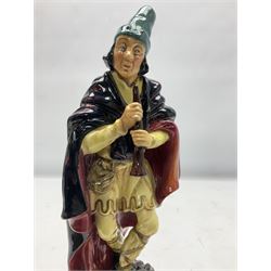 Three Royal Doulton figures, comprising The Pied Piper HN2102, The Mask Seller HN2103 and The Foaming Quart HN2162, all with printed marks beneath