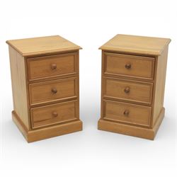 Pair of late 20th century waxed pine bedside chests, three drawers with moulded edges and ...