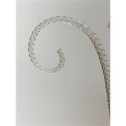 A Victorian cranberry and Vaseline glass epergne, the frilled bowl supporting two frilled trumpets and two canes, H41cm. 