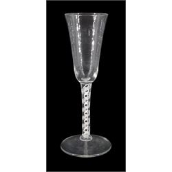 18th century toasting glass or flute, the funnel bowl upon a double series opaque twist stem and conical foot, H21cm
