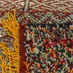 Moroccan Berber kilim rug, flatwoven with bands of geometric lozenge and chevron motifs in red, orange, ivory and green, decorated with applied sequins, fringed ends