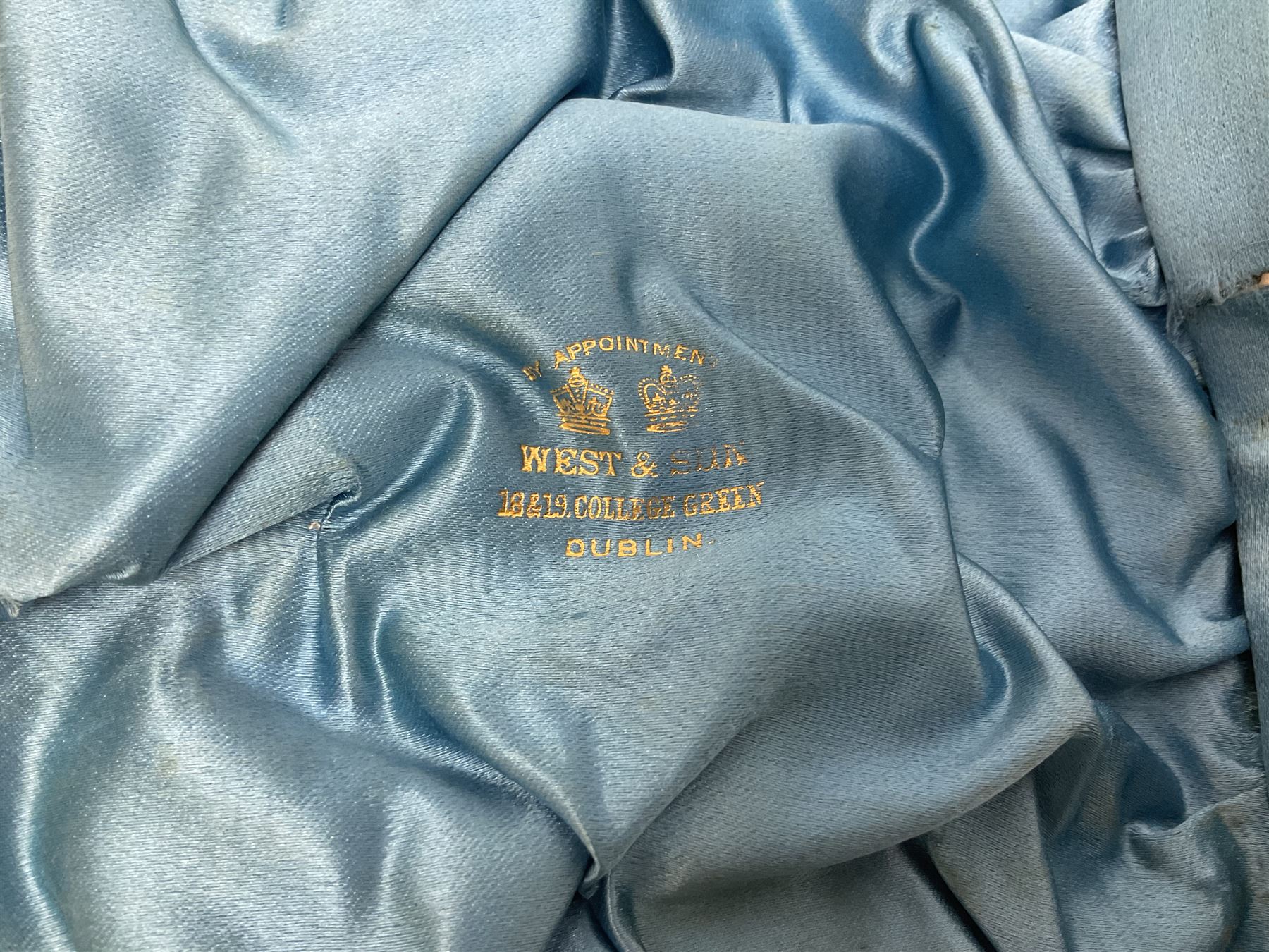 Victorian three-piece silver tea service, comprising teapot, twin handled open sucrier and milk jug, of oval form with shaped rim and C handles, each engraved with crests and bands of strapwork decoration, the milk jug and sucrier with gilt interiors, hallmarked Josiah Williams & Co, Exeter 1881, the teapot with ivory insulators and finial, all contained with a tooled leather, blue silk and velvet lined fitted case, retailed by West & Sun, Dublin 
This item has been registered for sale under Section 10 of the APHA Ivory Act