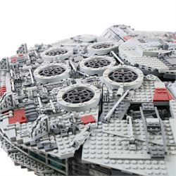 Three Lepin Star Wnrs built models, comprising Red Five X-Wing Starfighter no. 05039, Millennium Falcon no. 05132 and Super Star Destroyer no. 05028