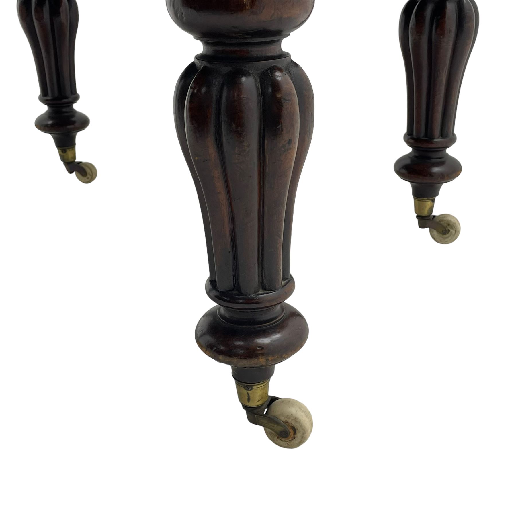 Victorian mahogany extending dining table, circular telescopic extending top with moulded edge, two additional leaves, on turned and lobe carved supports with brass and ceramic castors 