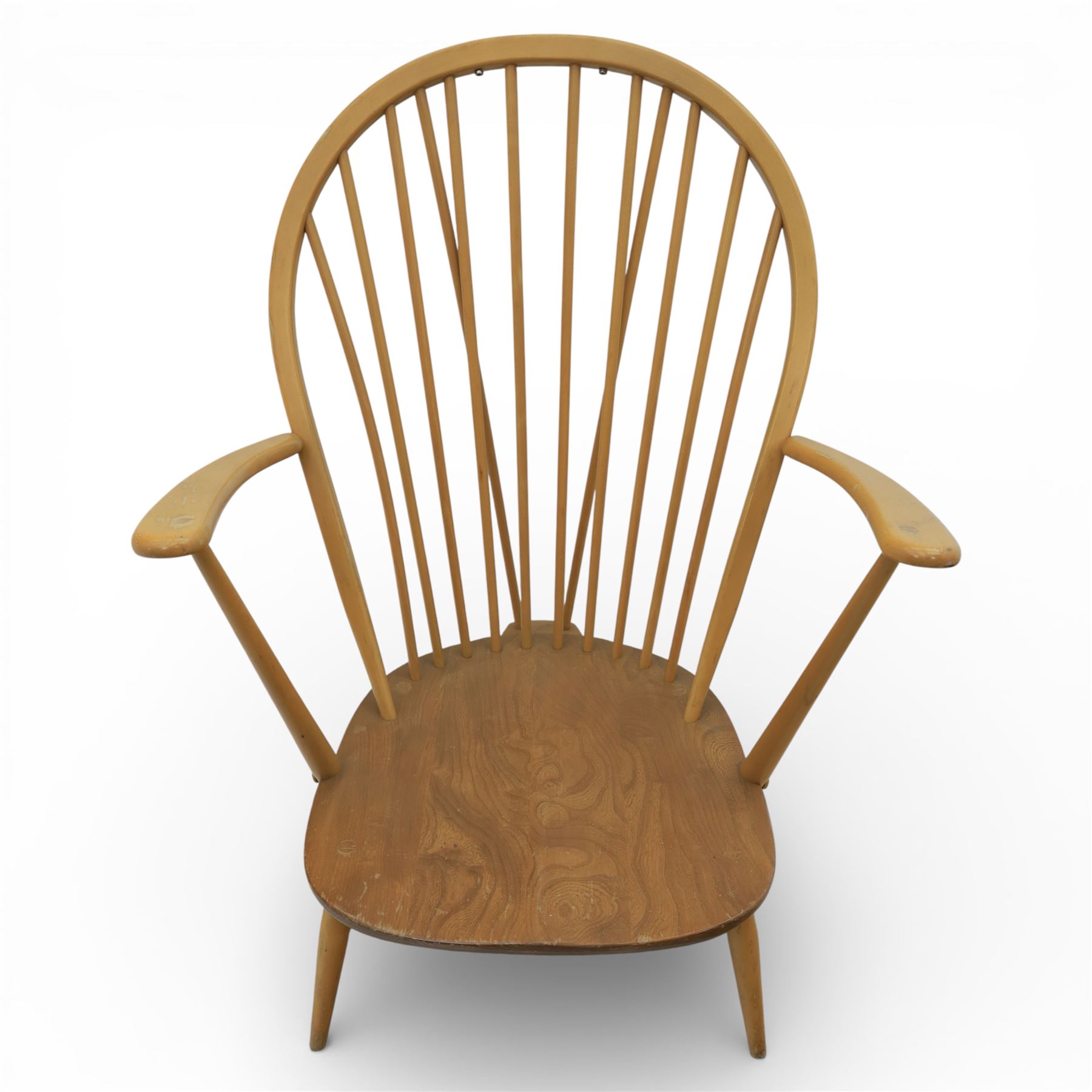 Ercol - Mid 20th century elm and beech Windsor armchair, the hooped spindle back over a shaped elm seat, with scroll front armrests on turned supports, raised on splayed tapering legs united by stretchers, lacking loose seat cushion