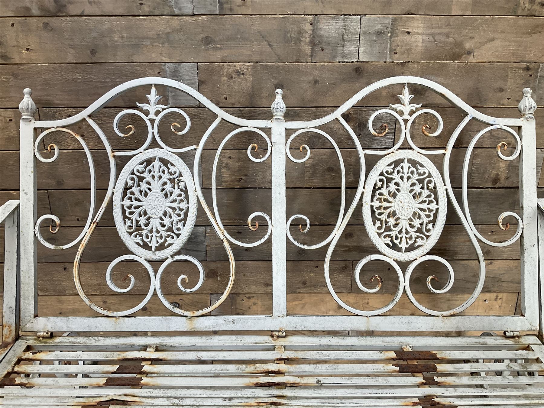 Wrought metal rocking garden bench seat, in antique grey finish