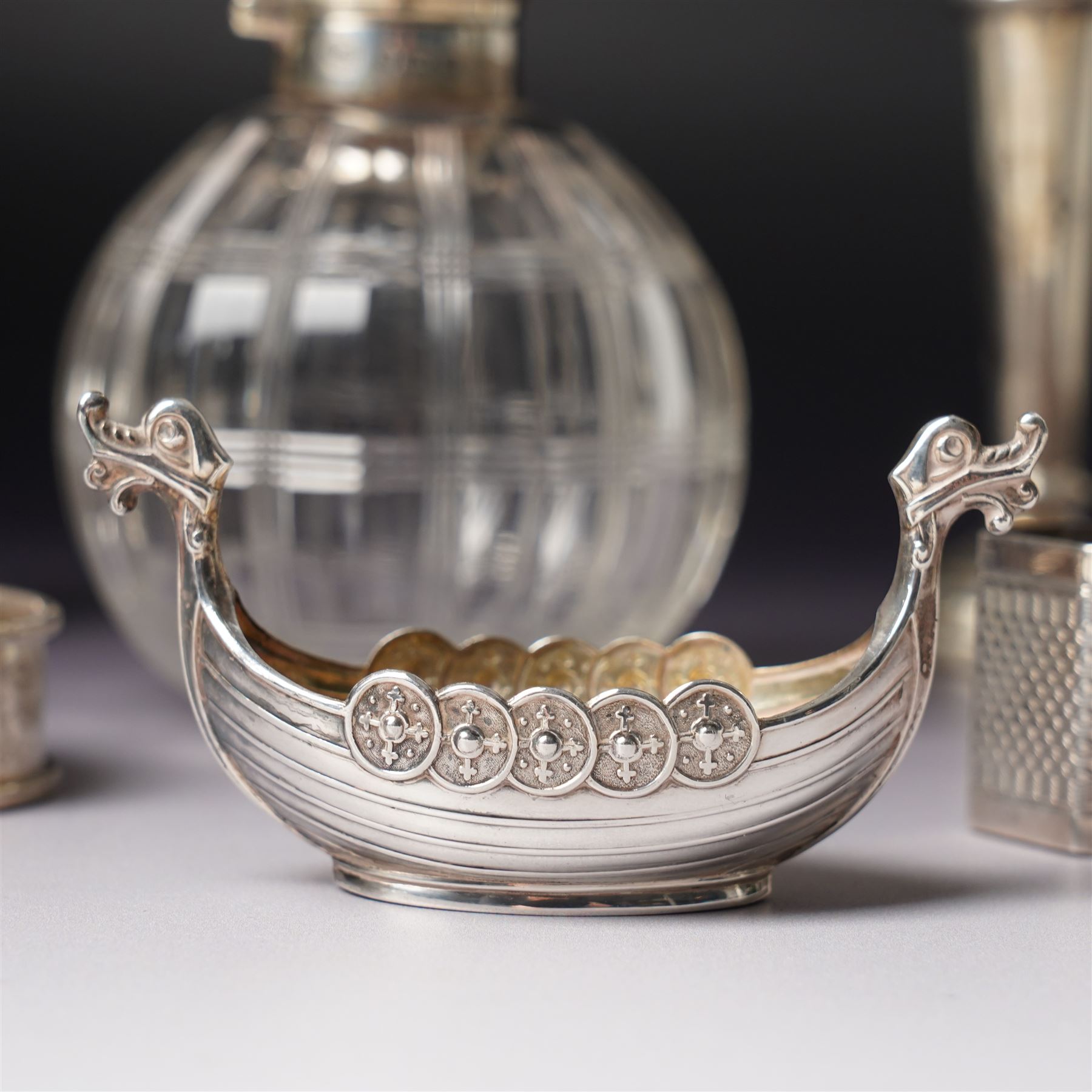 Small silver hip flask engraved with initials H9cm Sheffield 1988 Maker Hugh Crawshaw, silver pepper mill Sheffield 1975, globe scent flask with silver cover, four silver serviette rings, small silver vase and Norwegian silver salt