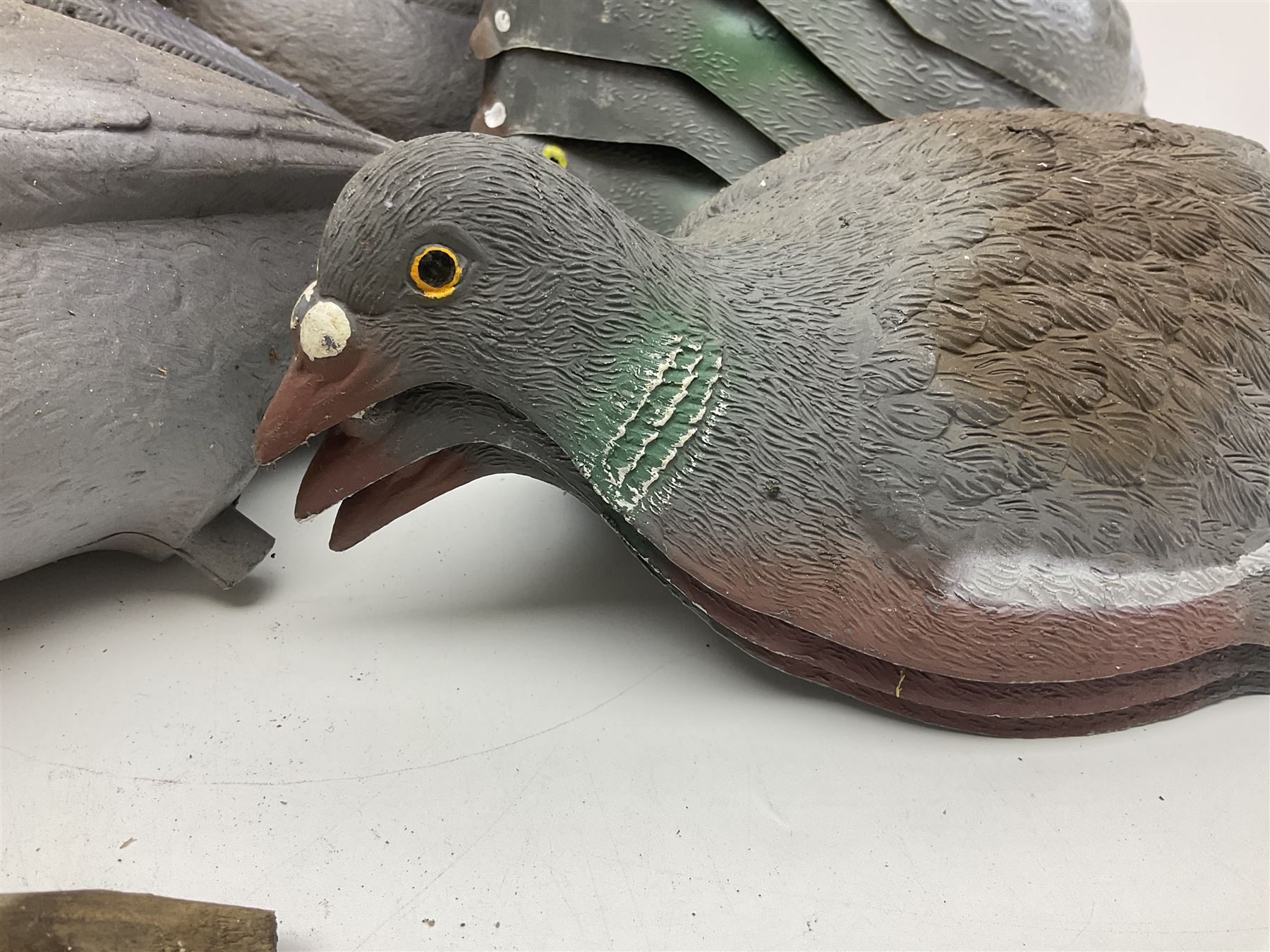 Eighteen plastic pigeon decoys comprising ten full body and eight shells with quantity of various stakes; some marked made in Italy
