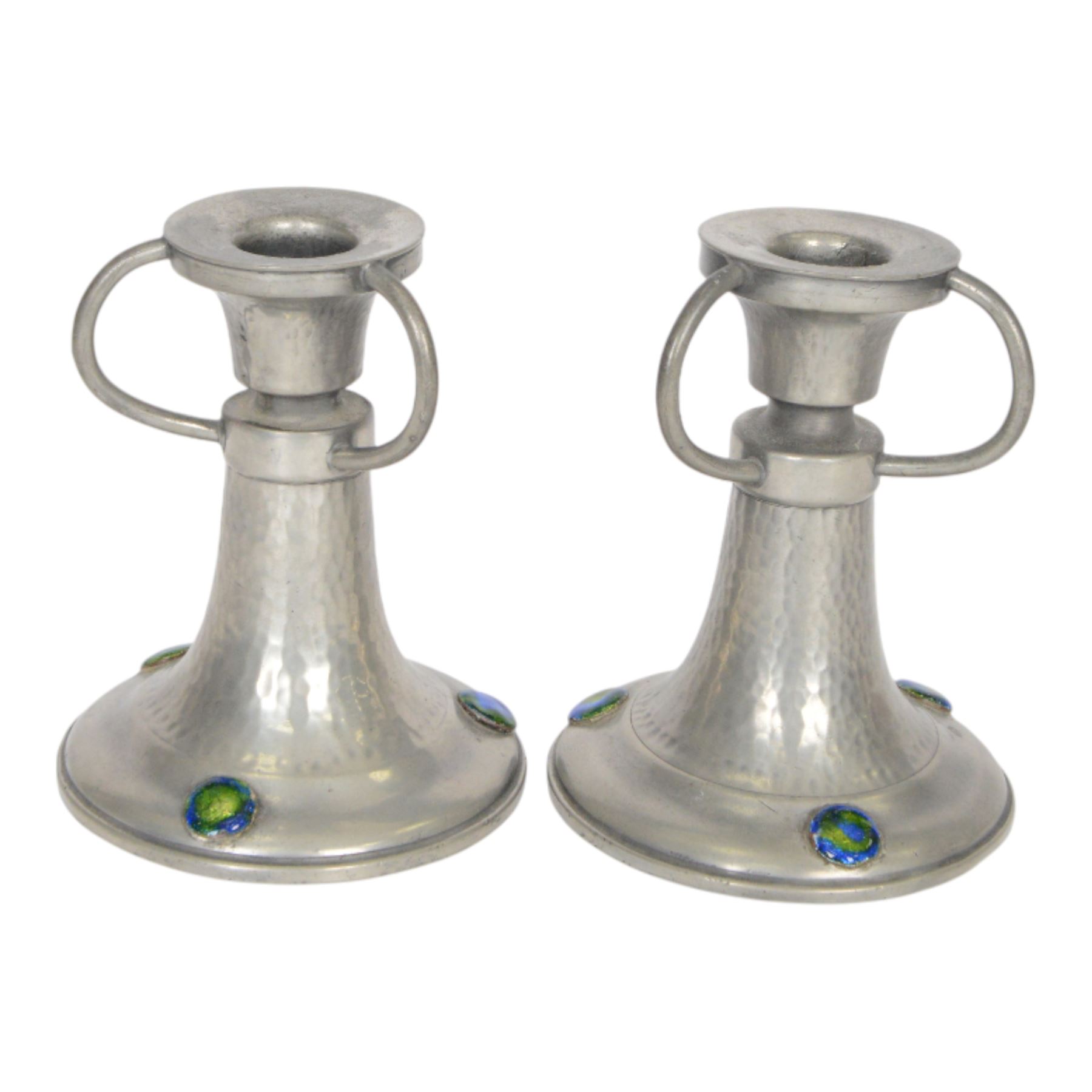 Pair of  Jugendstil hammered pewter candlestick each set with three blue and green enamel roundels, marked Germany beneath, H12cm