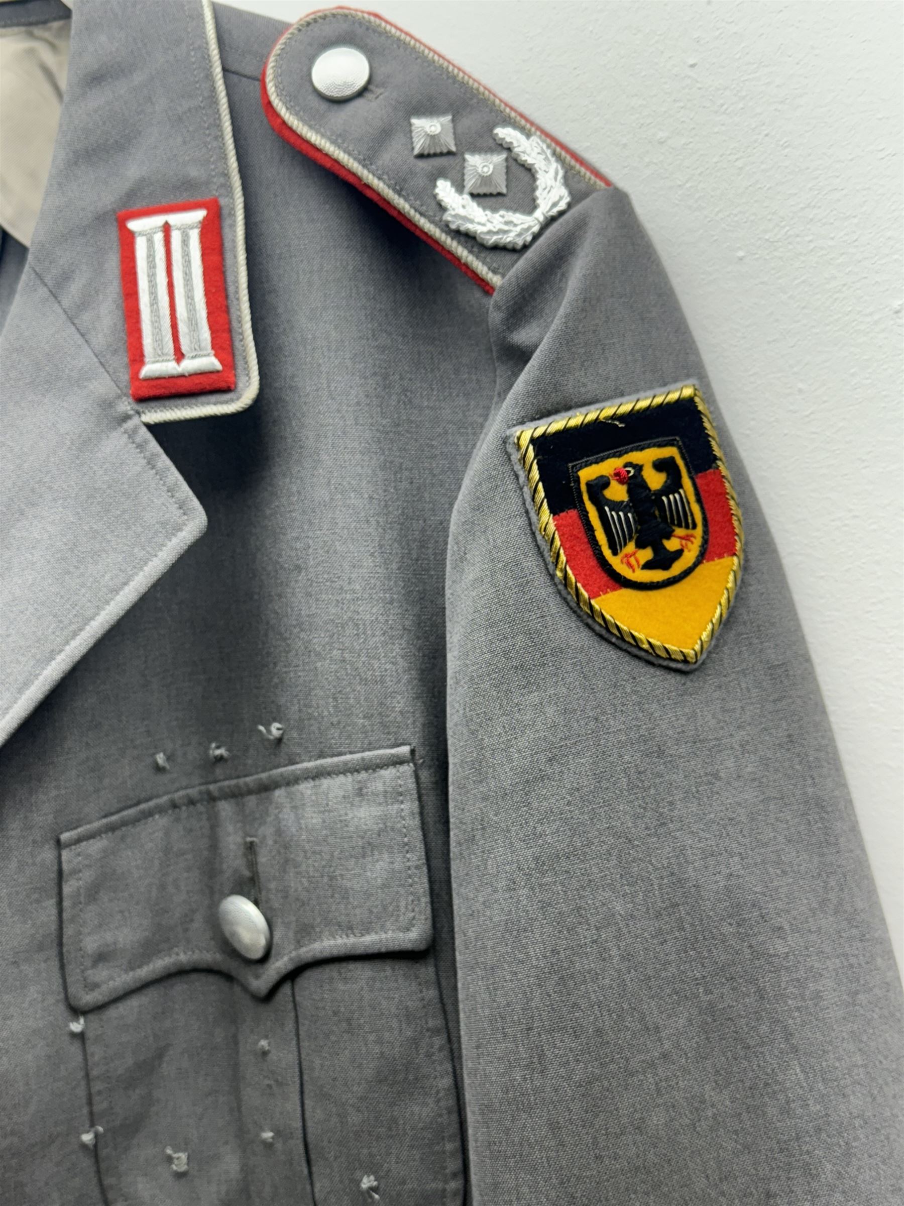 West German helmet steel helmet, together with 1960's peak cap and tunic with German insignias 