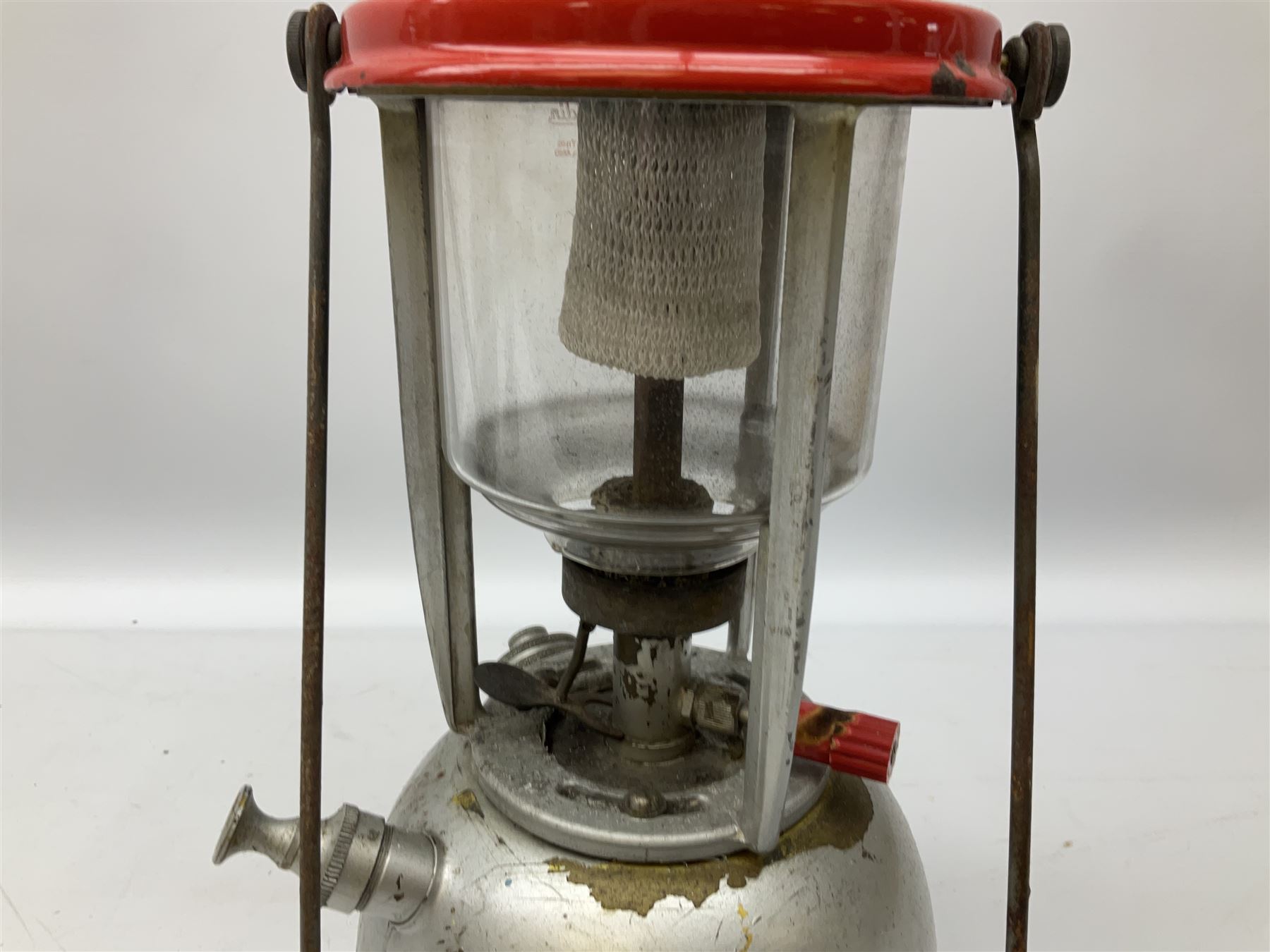 Copper and brass ship’s lamp marked ‘Anchor’, H25cm, Feuer hand storm lantern, Bialaddin Model 315 paraffin lamp and an Anchor lamp (4)