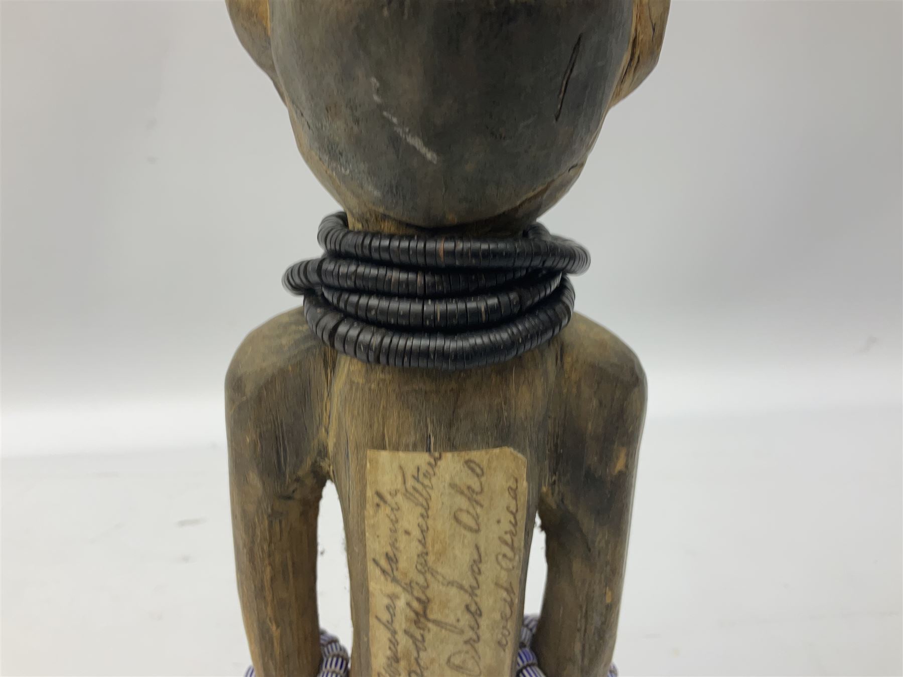 Early 20th century West African Yoruba family wooden figure of Orisha Oko, the god of farming/agriculture, carved from the solid, bears manuscript label of provenance verso H26.5cm