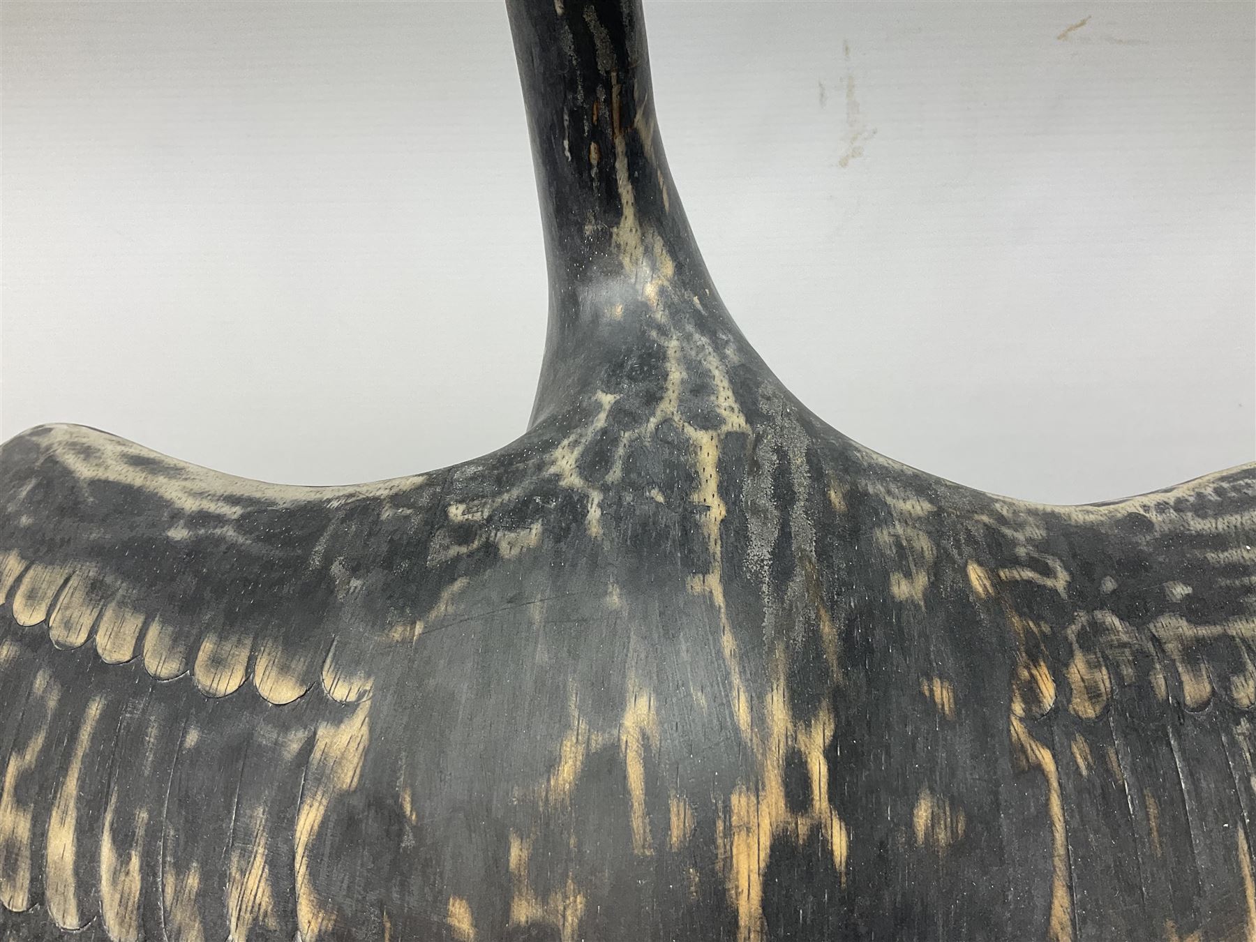 Wooden sculpture of Cormorant aquatic bird on a naturalistic wooden plinth, H46cm