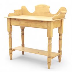20th century pine washstand, shaped three-quarter gallery back over rectangular top, raised on turned supports with lower undertier