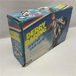 Ideal Derry Daring and Her Trick Cycle, with clothed figure on trick cycle and winder; in original illustrated box dated 1975