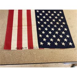 Vietnam War; two North Vietnamese military flags, together with a United States Marine Corps Vietnam period stars and stripes flag 