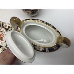 Collection of Royal Crown Derby Imari pattern, comprising covered trinket box, twin handled sucrier and saucer, oval dish and vase, all with printed marks beneath  
