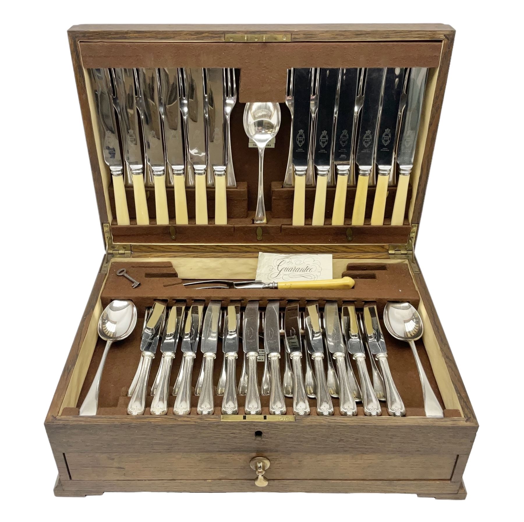 Twelve place setting canteen of cutlery by Lee & Wigfull Ltd, cased in an oak  chest, with key, meat carvers are missing, H18cm, L44cm 